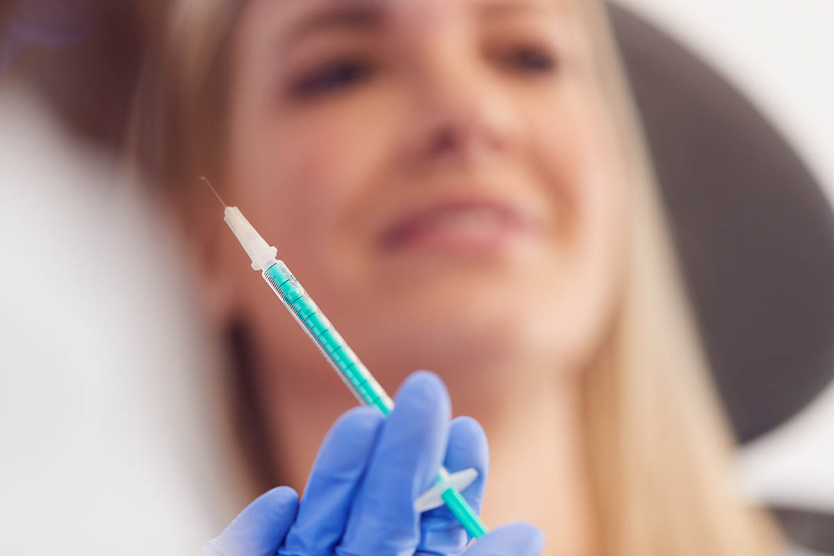 Doctor Preparing Patient For Dermal Filler