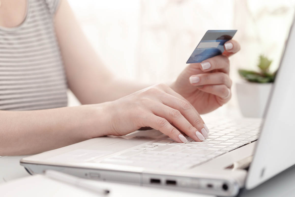 Female hands using credit card